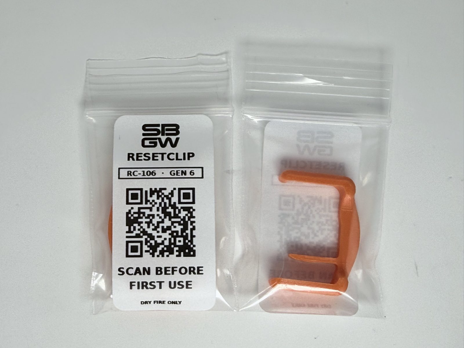 Two individually bagged ResetClips labelled RC-106, Gen 6, front and back, with a QR code reading Scan before first use.